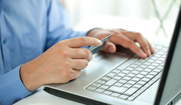 Man with a Credit Card and a Laptop