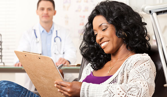 Woman Completing Doctor Forms