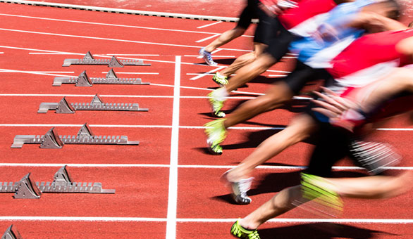 Athletes Starting a Race on a Track